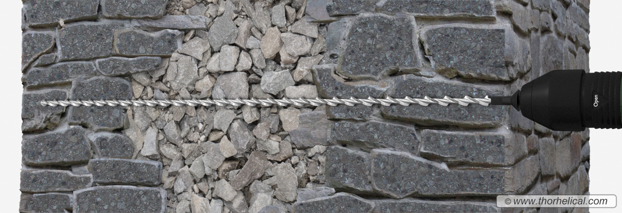Tying rubble filled walls with helical tie bars